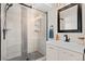 Elegant bathroom featuring a glass-enclosed shower, stylish vanity, and modern fixtures at 24738 E Layton Pl, Aurora, CO 80016