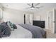 Spacious bedroom featuring a view of the walk-in closet and en suite bathroom at 24738 E Layton Pl, Aurora, CO 80016