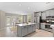 Charming dining area featuring a wooden table, and direct access to the kitchen and backyard at 24738 E Layton Pl, Aurora, CO 80016
