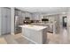 Modern kitchen featuring stainless steel appliances, granite countertops, a kitchen island and light gray cabinets at 24738 E Layton Pl, Aurora, CO 80016