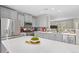Spacious kitchen featuring stainless steel appliances, granite countertops, a central island, and lots of cabinet space at 24738 E Layton Pl, Aurora, CO 80016