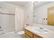 Full bathroom with shower/tub combo, vanity, and updated fixtures at 1411 Maple Dr, Berthoud, CO 80513