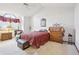 Spacious Primary bedroom with a king-size bed and sitting area at 1411 Maple Dr, Berthoud, CO 80513