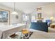 Bright dining area with table, chairs, and view of the living room at 1411 Maple Dr, Berthoud, CO 80513