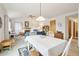 Dining area with table and chairs, offering open views to living room and fireplace at 1411 Maple Dr, Berthoud, CO 80513