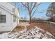 Two-story house with fenced backyard and landscaping at 1411 Maple Dr, Berthoud, CO 80513