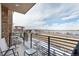 Balcony with seating overlooking scenic lake views at 2641 Channel Dr, Highlands Ranch, CO 80129