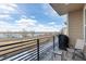 Cozy balcony with lake views, seating, and a grill at 2641 Channel Dr, Highlands Ranch, CO 80129