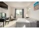 Bedroom with a full wall of windows, neutral carpet, and a small vanity at 2641 Channel Dr, Highlands Ranch, CO 80129