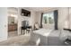 Bedroom with ensuite bathroom, neutral carpet, a vanity and picturesque window at 2641 Channel Dr, Highlands Ranch, CO 80129