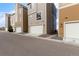 Row of modern townhomes with individual garages and clean landscaping at 2641 Channel Dr, Highlands Ranch, CO 80129