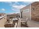 Roof deck with fire pit and outdoor seating overlooking neighborhood at 2641 Channel Dr, Highlands Ranch, CO 80129