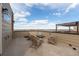 Roof deck with fire pit, pergola, and outdoor seating overlooking the lake at 2641 Channel Dr, Highlands Ranch, CO 80129