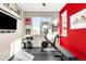 Bright home exercise room with fitness equipment and natural light from the windows at 9305 Gore St # A, Arvada, CO 80007