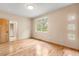 Spacious bedroom with hardwood floors, natural light, and easy access to ensuite bathroom at 209 Saratoga Mine Dr, Castle Rock, CO 80108