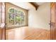 Bright room with large window, hardwood floors, and access to a private patio at 209 Saratoga Mine Dr, Castle Rock, CO 80108