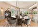 Open dining area with modern table, chairs and access to outdoor patio at 209 Saratoga Mine Dr, Castle Rock, CO 80108