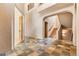 Grand foyer with an open staircase and stylish tiled flooring at 209 Saratoga Mine Dr, Castle Rock, CO 80108