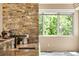 Close-up of the kitchen counter, showcasing stone walls and modern fixtures at 209 Saratoga Mine Dr, Castle Rock, CO 80108