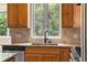 Updated kitchen with granite countertops, stainless steel appliances, and an undermount sink at 209 Saratoga Mine Dr, Castle Rock, CO 80108