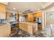 Modern kitchen featuring a central island, premium appliances, and custom cabinetry at 209 Saratoga Mine Dr, Castle Rock, CO 80108