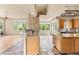 Wide view of the kitchen showcasing stone-clad wall and open floorplan at 209 Saratoga Mine Dr, Castle Rock, CO 80108