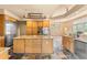Gourmet kitchen with island, granite countertops, and stainless steel appliances at 209 Saratoga Mine Dr, Castle Rock, CO 80108