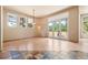 Bright living room with access to the patio and large windows providing ample natural light at 209 Saratoga Mine Dr, Castle Rock, CO 80108