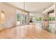Open-concept living area with wood floors, access to the patio, and seamless flow at 209 Saratoga Mine Dr, Castle Rock, CO 80108