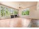 Inviting living room with a fireplace, large windows, and a ceiling fan at 209 Saratoga Mine Dr, Castle Rock, CO 80108