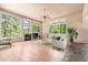 Bright living room featuring fireplace, hardwood floors and large windows at 209 Saratoga Mine Dr, Castle Rock, CO 80108