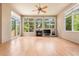 Inviting living room with a cozy fireplace and access to the outdoor balcony at 209 Saratoga Mine Dr, Castle Rock, CO 80108