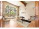 Bright home office with arched window, wood floors, and stylish decor at 209 Saratoga Mine Dr, Castle Rock, CO 80108