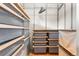 Custom walk-in closet featuring metal shelving and storage baskets at 209 Saratoga Mine Dr, Castle Rock, CO 80108