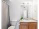 Bathroom featuring a toilet and a wood vanity topped with neutral countertop at 912 S Yampa St # 206, Aurora, CO 80017