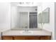 Modest bathroom vanity featuring a white sink and large mirrored backsplash at 912 S Yampa St # 206, Aurora, CO 80017