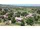 Panoramic aerial view of the property highlighting its manicured lawn, landscaping, and surrounding upscale neighborhood at 10886 Pheasant Run, Littleton, CO 80125