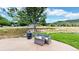 Backyard patio features outdoor seating, a fire pit, and mountain views at 10886 Pheasant Run, Littleton, CO 80125