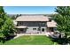 Expansive home with lush backyard, patio, and hot tub offering breathtaking views and outdoor enjoyment at 10886 Pheasant Run, Littleton, CO 80125