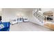 Elegant foyer with staircase, neutral carpeting, and sitting area at 10886 Pheasant Run, Littleton, CO 80125