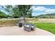 Relax on the patio with a cozy fire pit and ample seating, ideal for outdoor entertaining and scenic views at 10886 Pheasant Run, Littleton, CO 80125