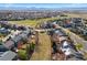 An aerial view of a suburban neighborhood with mountain views on a sunny day at 1788 Alpine Dr, Erie, CO 80516