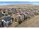 Aerial view of a suburban neighborhood with hills in the background at 1788 Alpine Dr, Erie, CO 80516