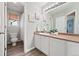 Bright bathroom featuring an extra large mirror over an extended vanity at 1788 Alpine Dr, Erie, CO 80516