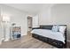 Cozy bedroom with a daybed, bookshelf, and doorway leading to a hallway at 1788 Alpine Dr, Erie, CO 80516