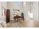 Inviting foyer featuring high ceilings, natural light, and a grand piano at 1788 Alpine Dr, Erie, CO 80516