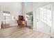 Inviting foyer with high ceilings, natural light, and grand piano at 1788 Alpine Dr, Erie, CO 80516