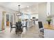 Bright eat-in kitchen with white cabinets, stainless appliances, island, and breakfast nook at 1788 Alpine Dr, Erie, CO 80516