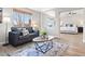 Bright living room showcasing a stylish couch, rug, and plenty of natural light creating a cozy space at 1788 Alpine Dr, Erie, CO 80516