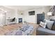 Cozy living area with fireplace, TV, modern furniture, and stylish decor at 1788 Alpine Dr, Erie, CO 80516